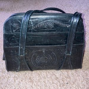 Hand tooled leather handbag